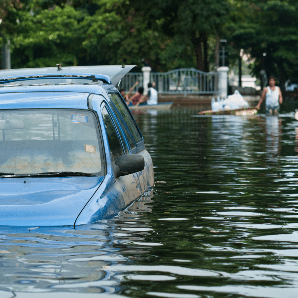 A submerged car in flooded areas