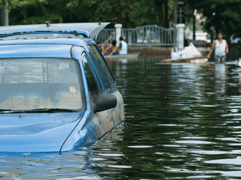 A submerged car in flooded areas